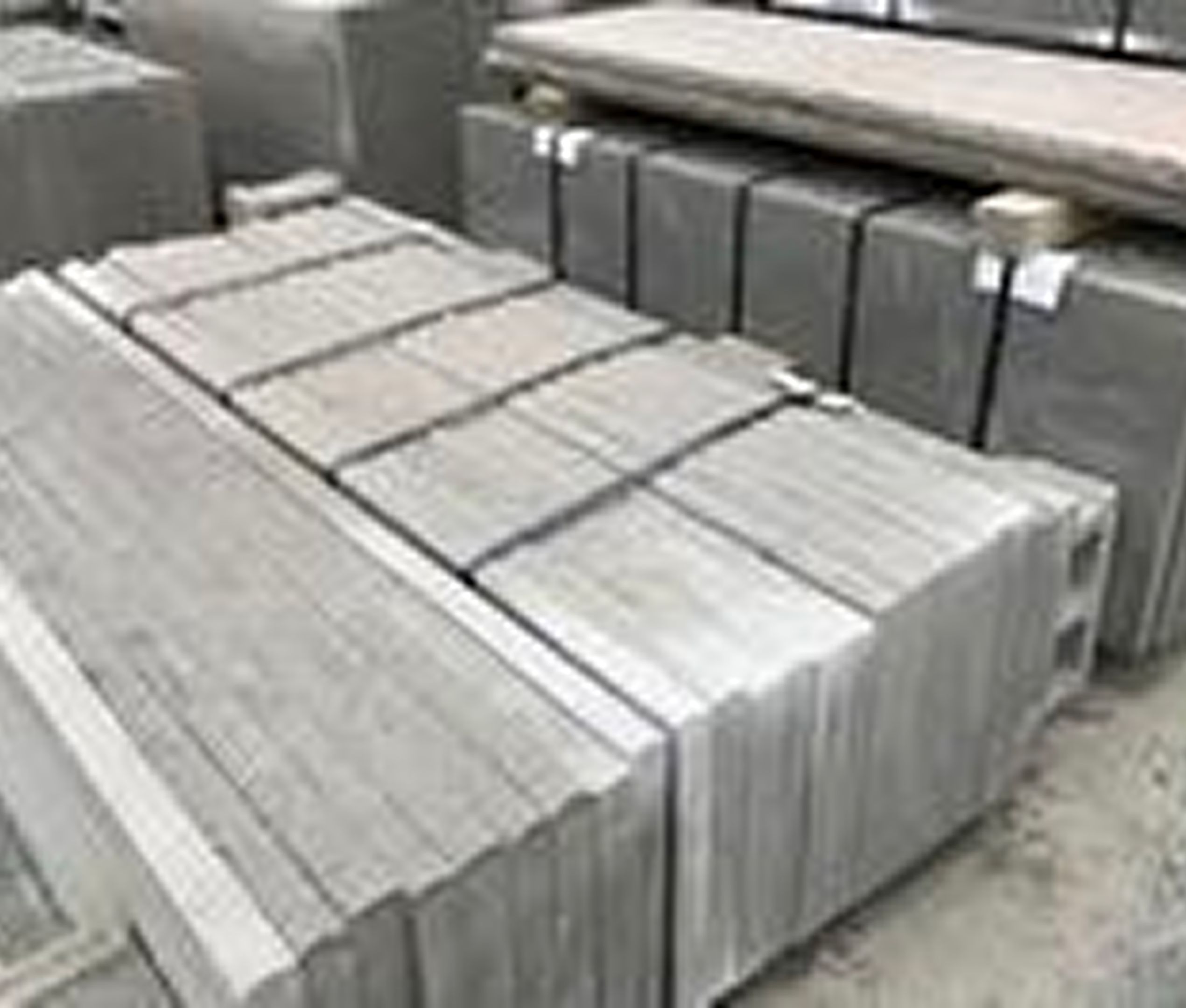 Stacked metal bars in a warehouse