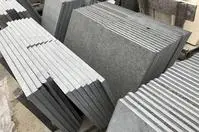 Stacked granite slabs in warehouse