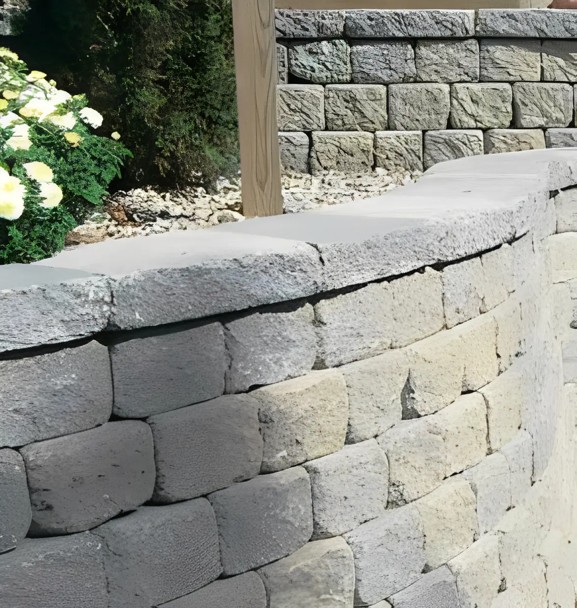 Curved stone wall and greenery