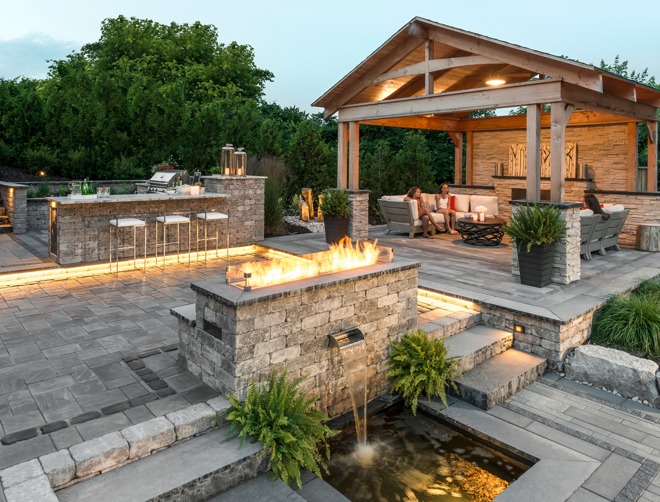 Modern backyard with pergola and lighting