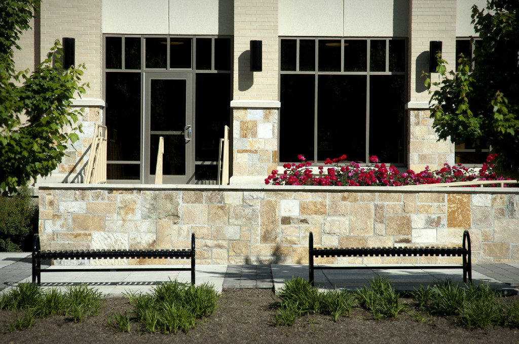 Benches outside a building with flowers