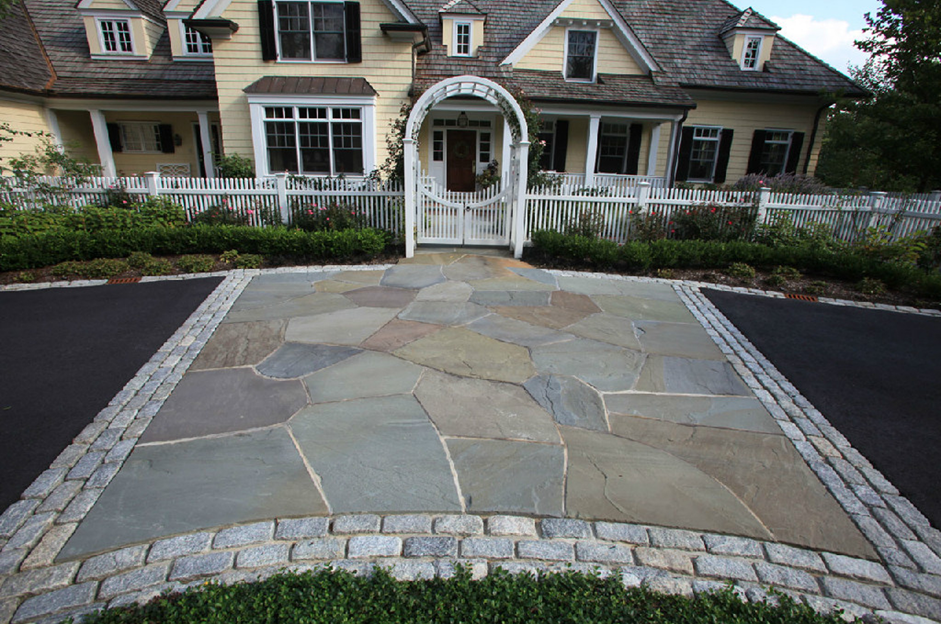 Stone path leading to a charming house