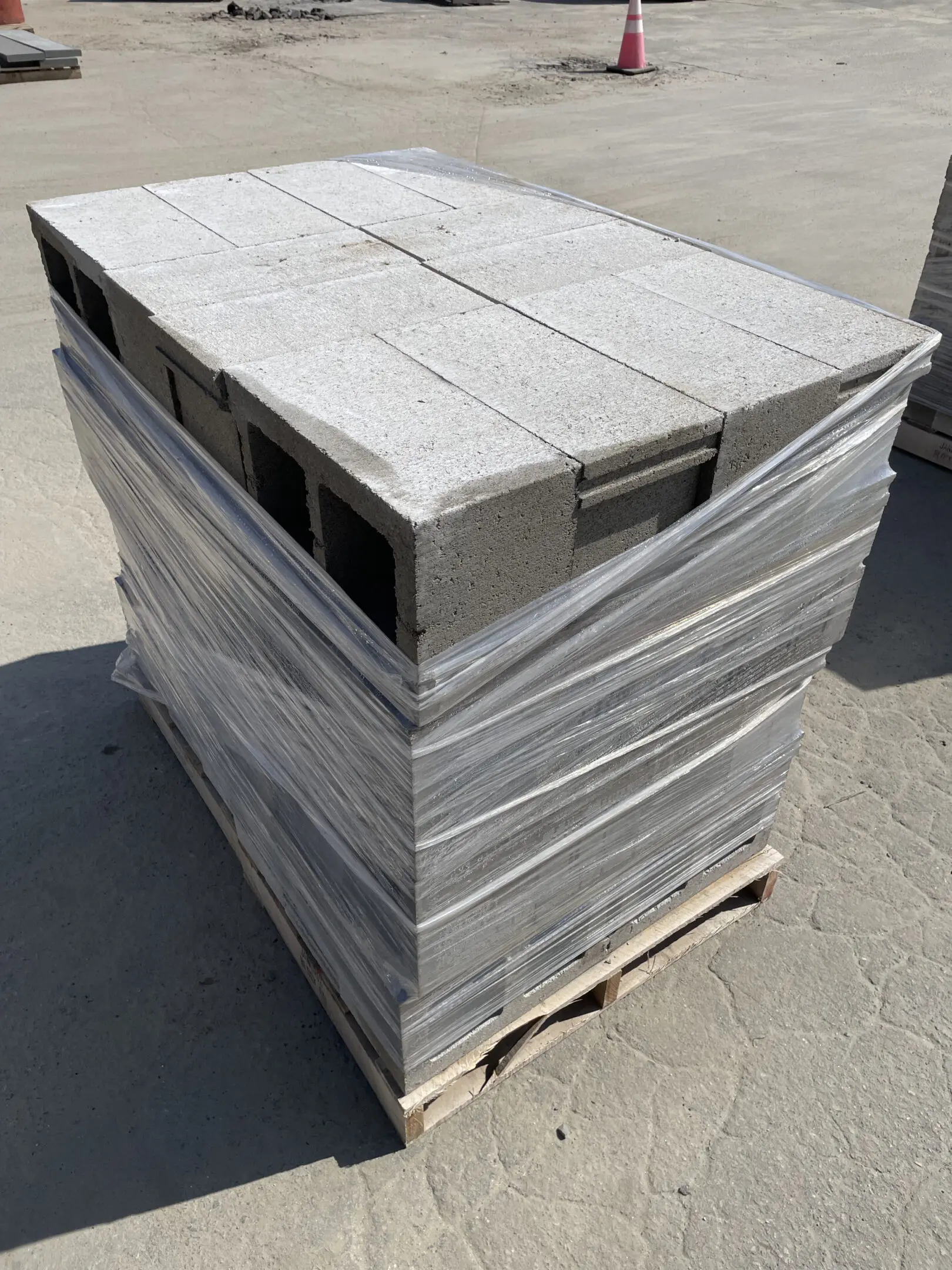 Wrapped concrete blocks on wooden pallet