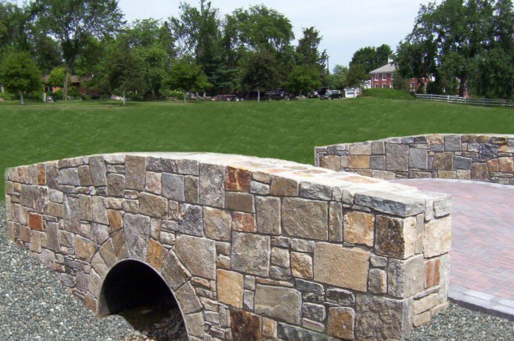 Rustic stone bridge in park setting