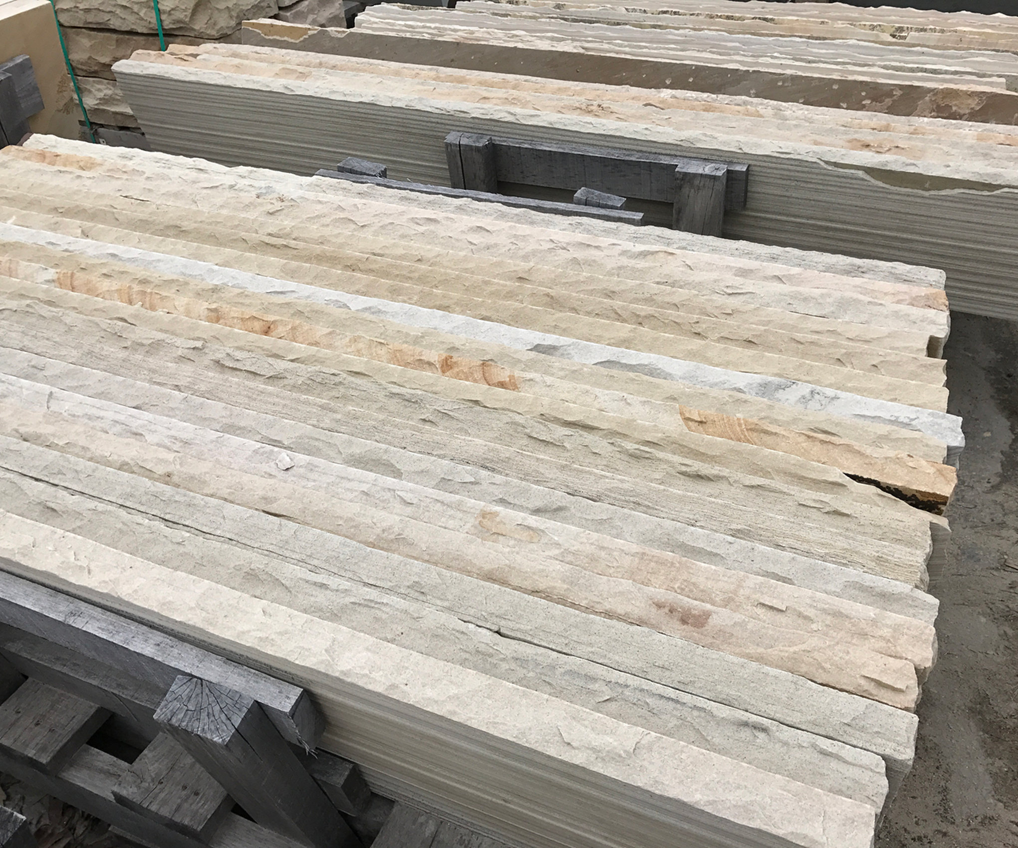 Stone slabs stacked in a yard