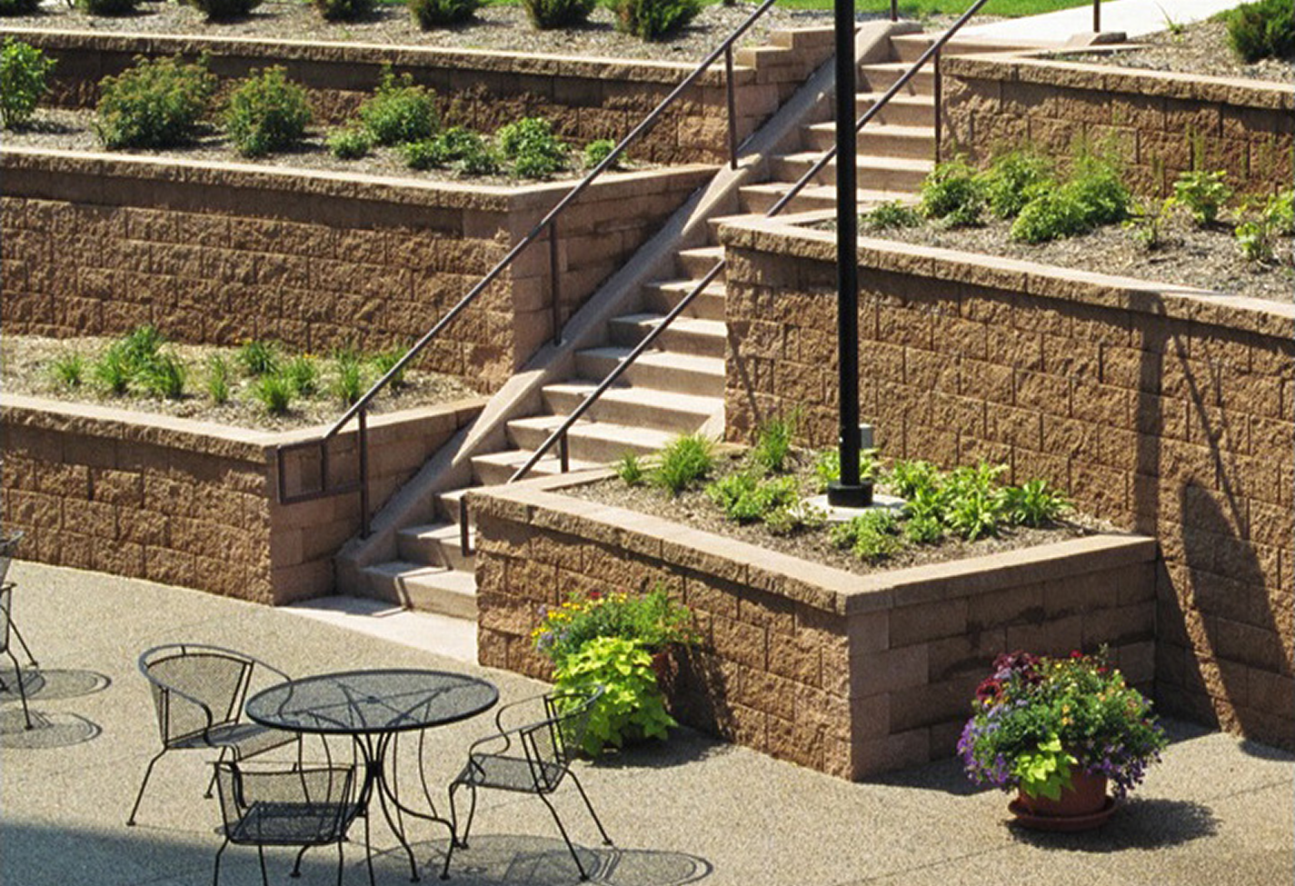 Garden terrace with metal chairs and tables
