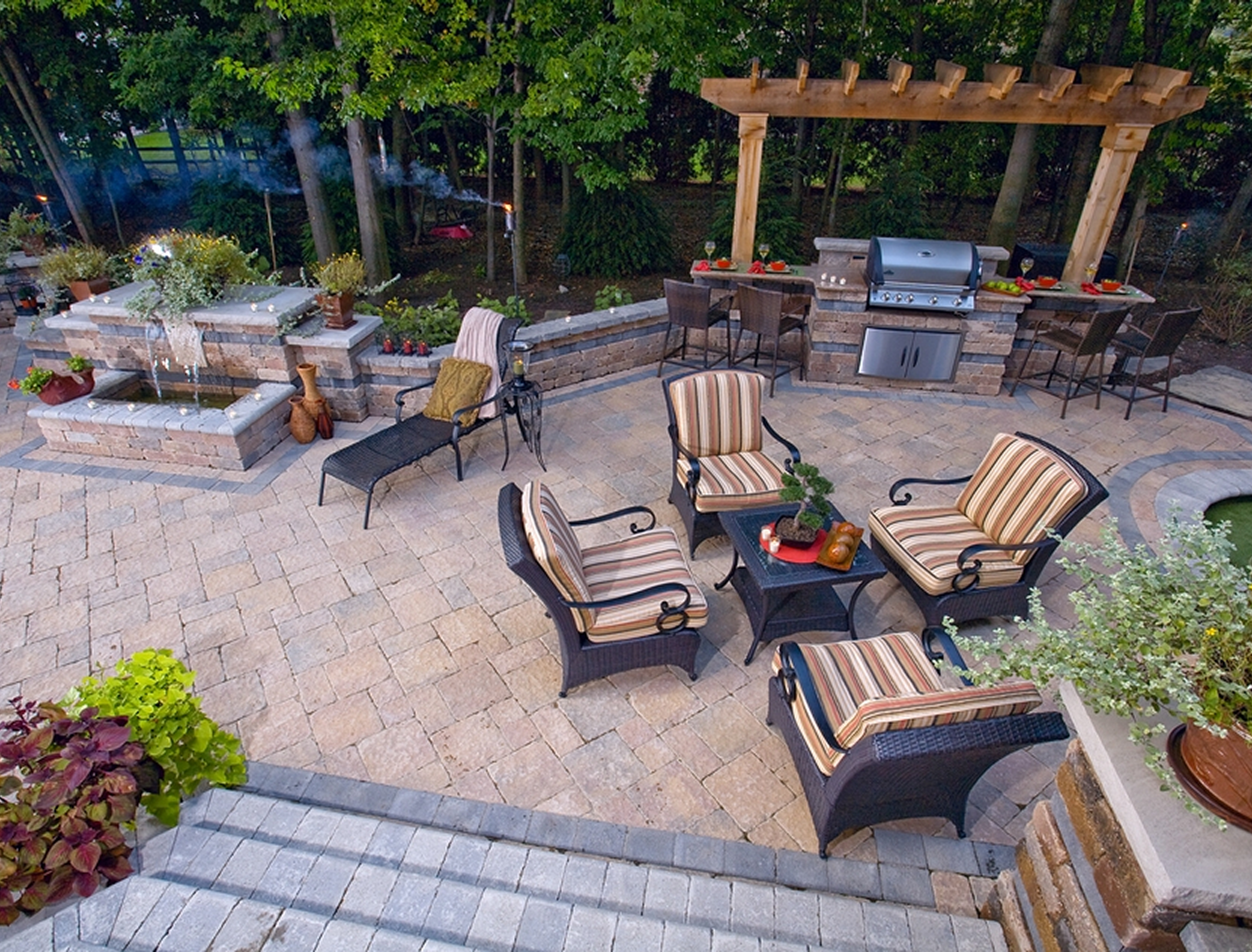 Outdoor patio with seating and grill