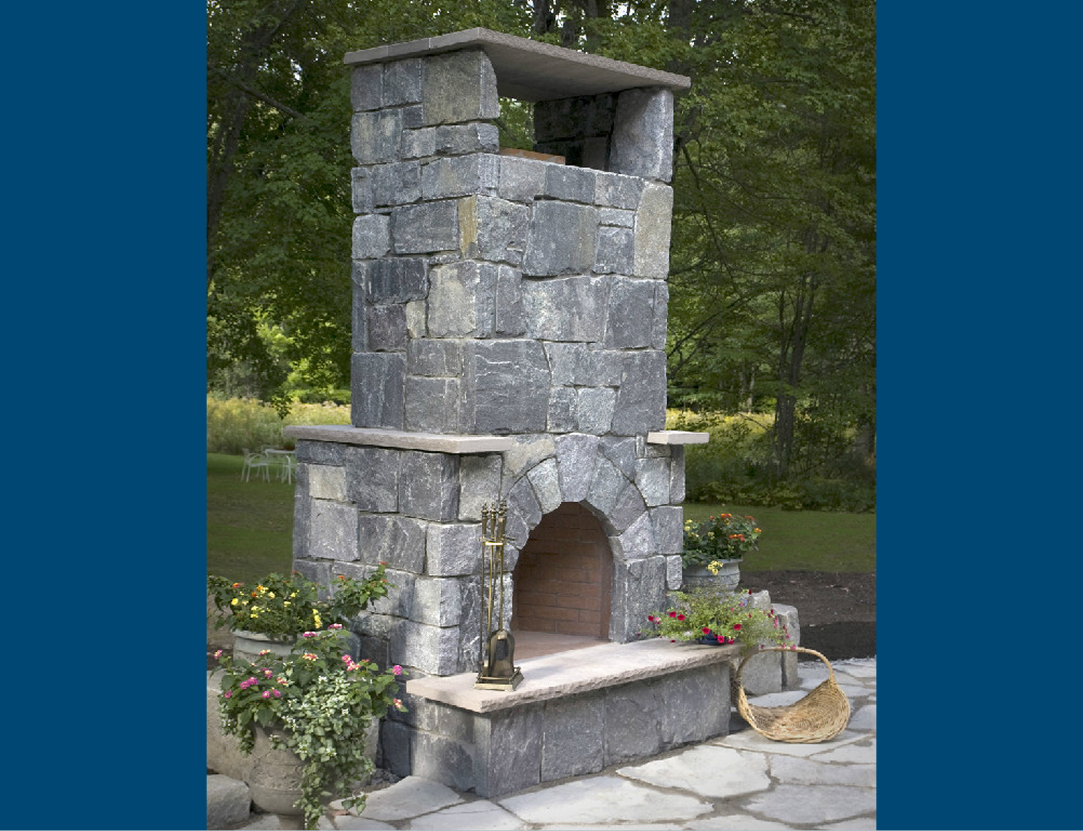 Tall stone fireplace in garden setting