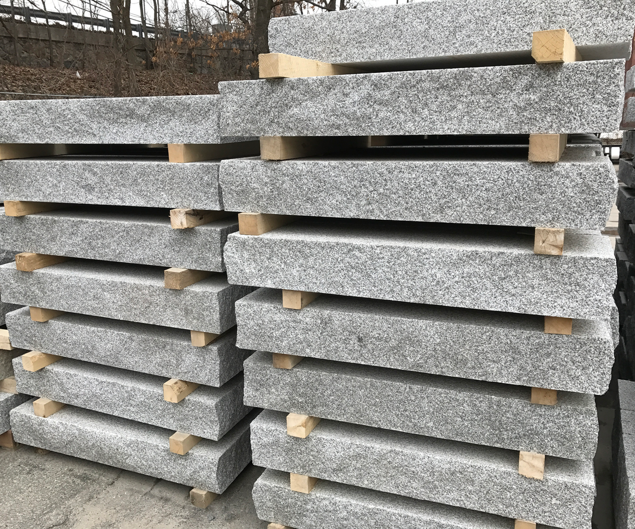Piles of grey stone blocks outdoors