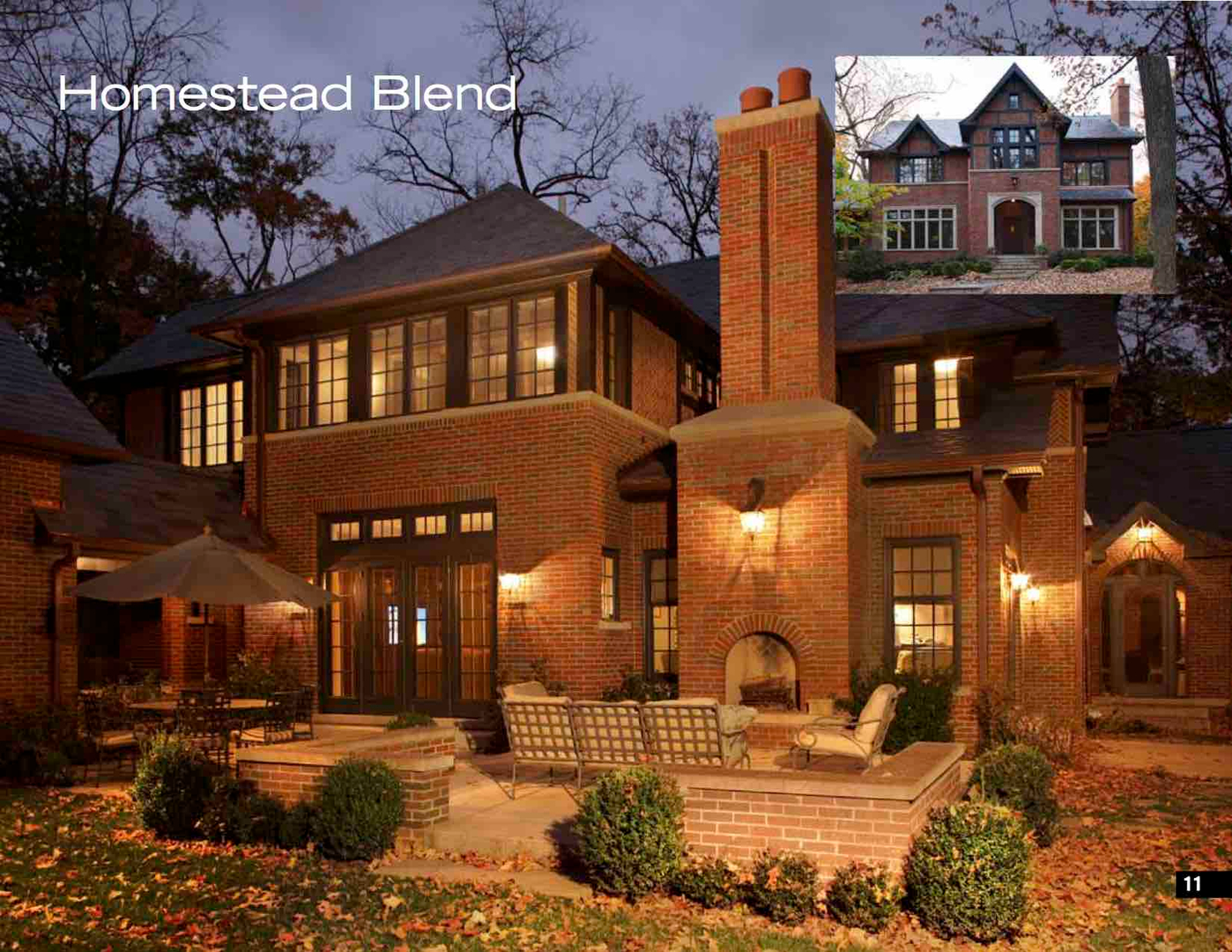 Evening view of charming brick residence