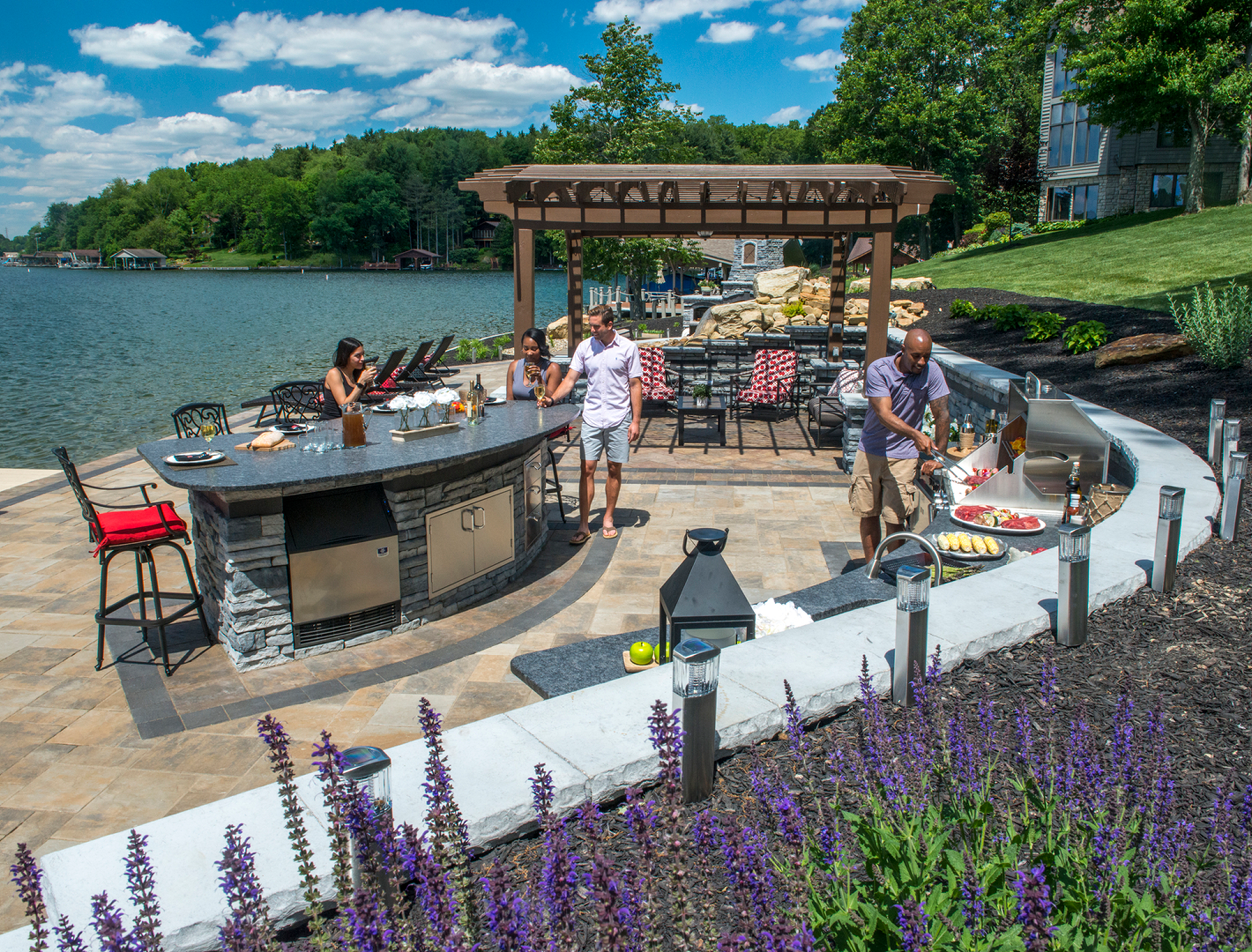 Scenic outdoor kitchen with guests