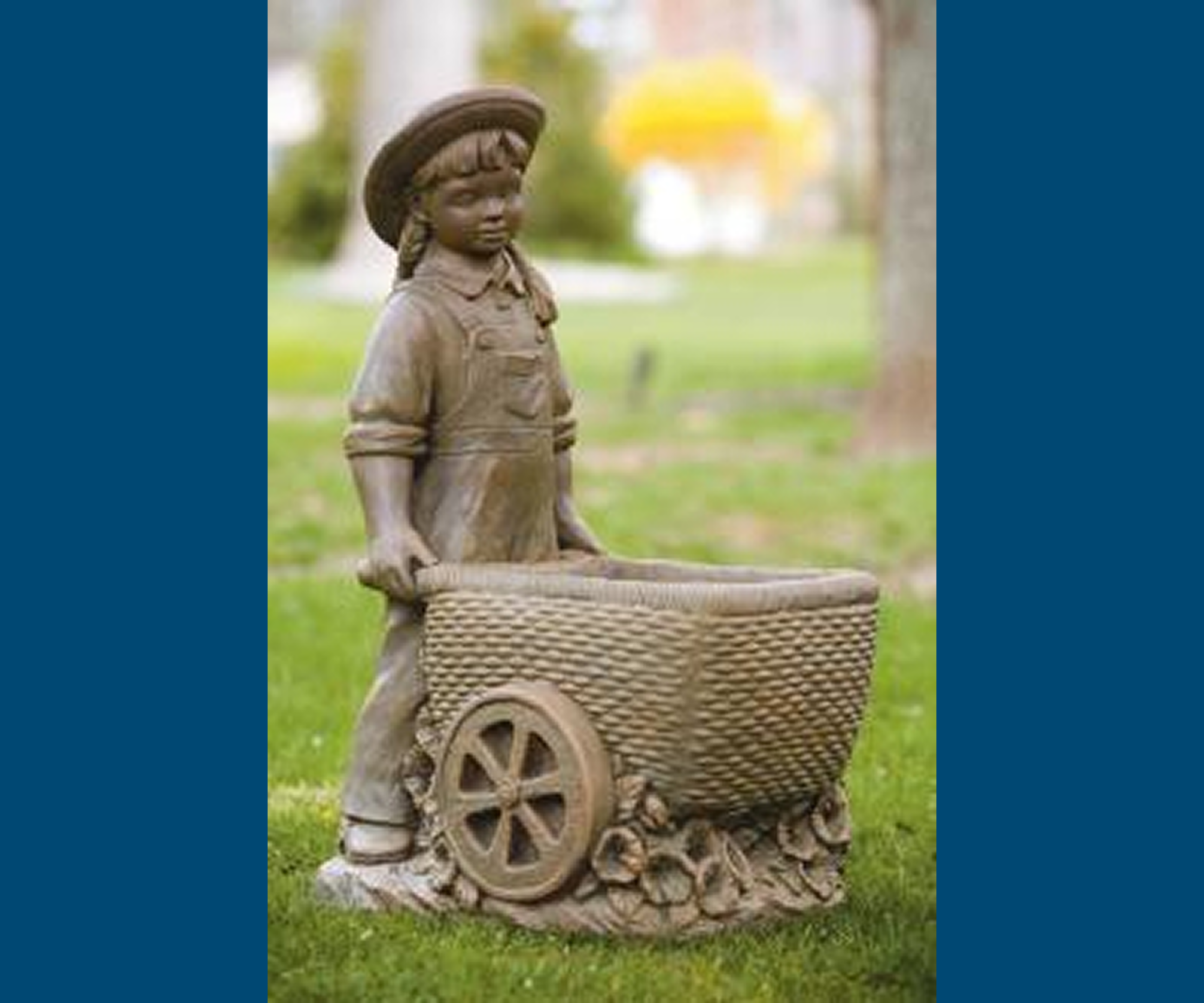 Stone sculpture of child and wheelbarrow