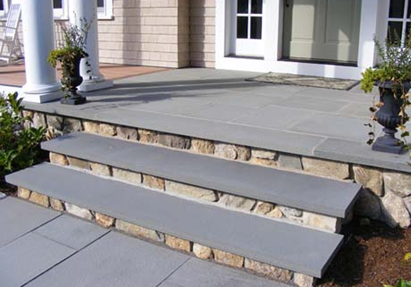 Elegant porch entrance with planters