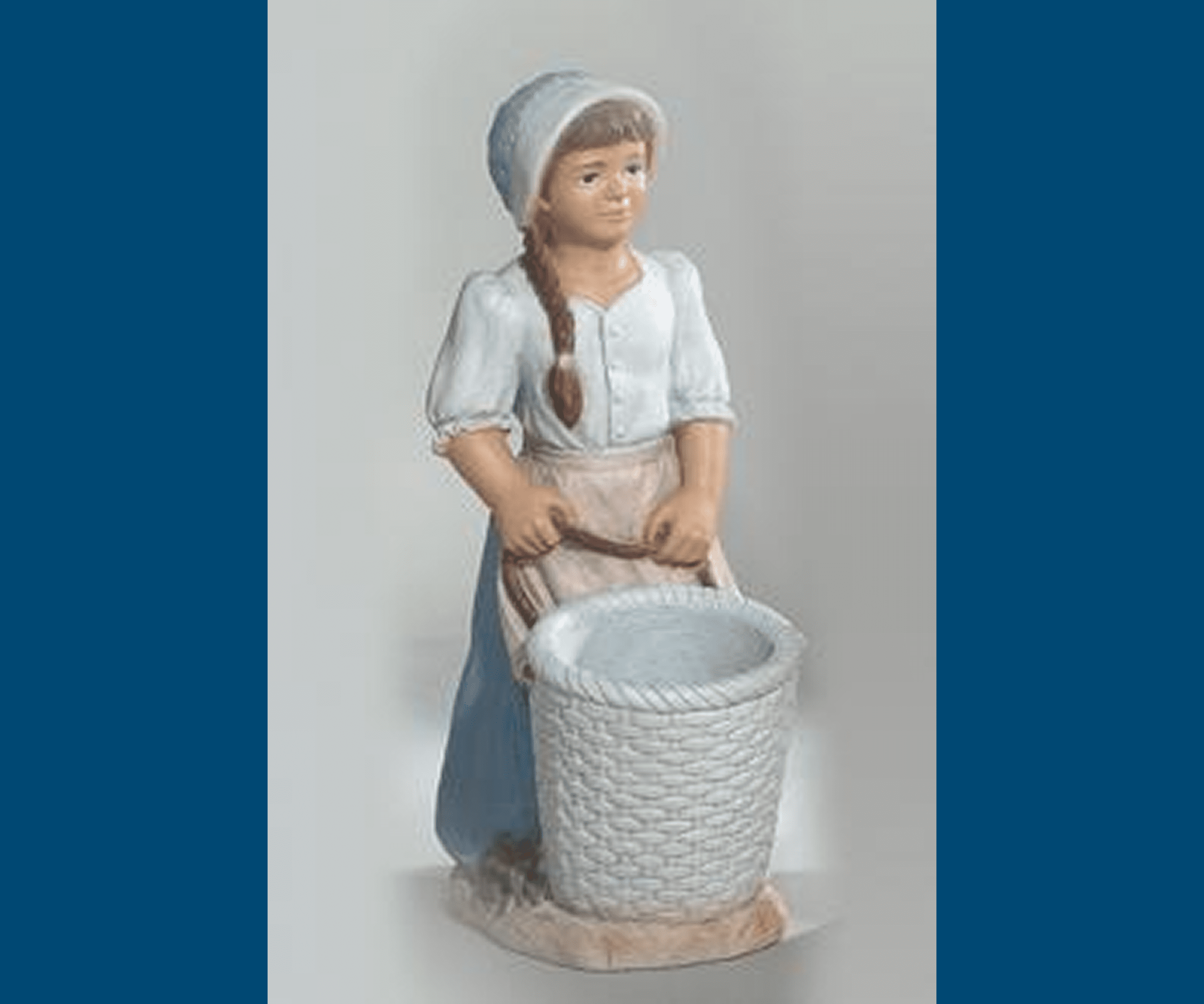 Ceramic girl statue holding basket