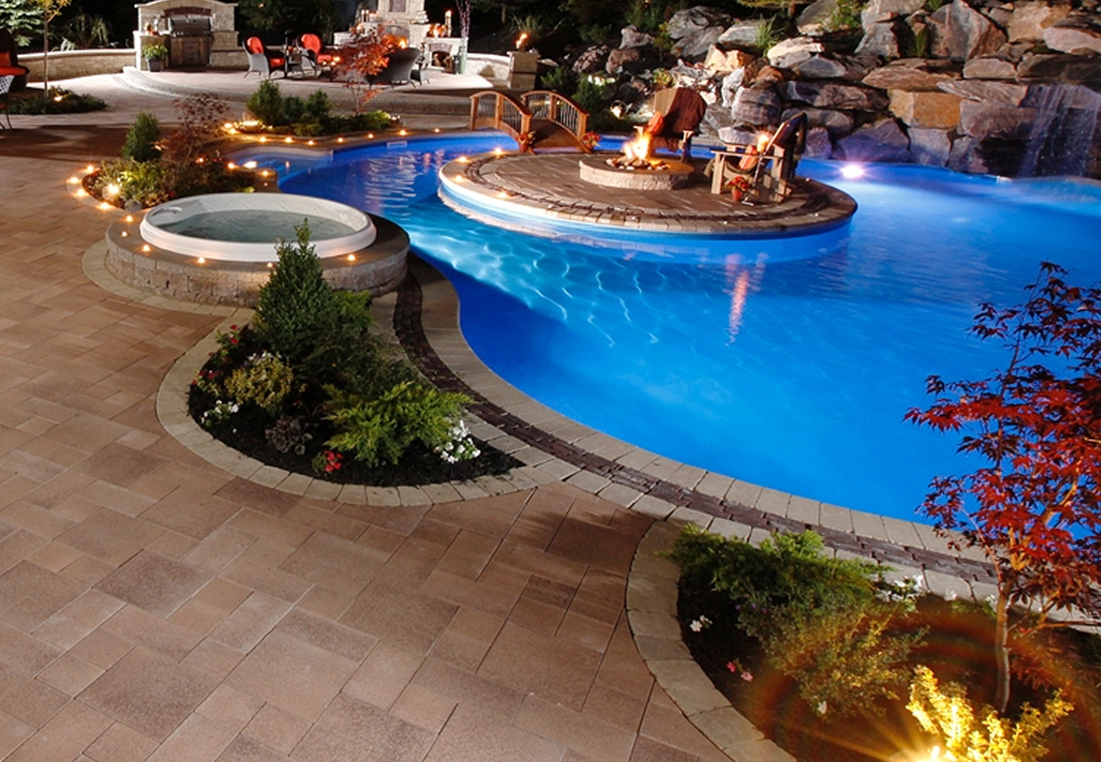 Elegant backyard with pool and hot tub