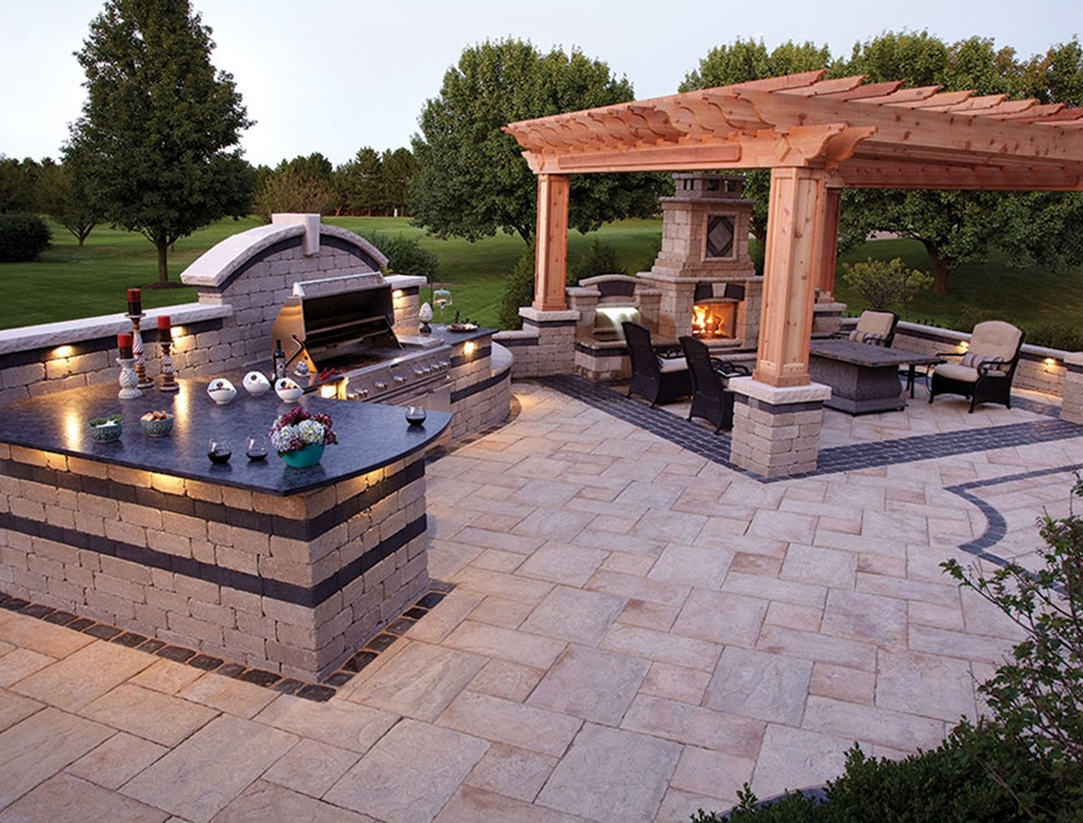 Elegant patio with stone barbecue and seating
