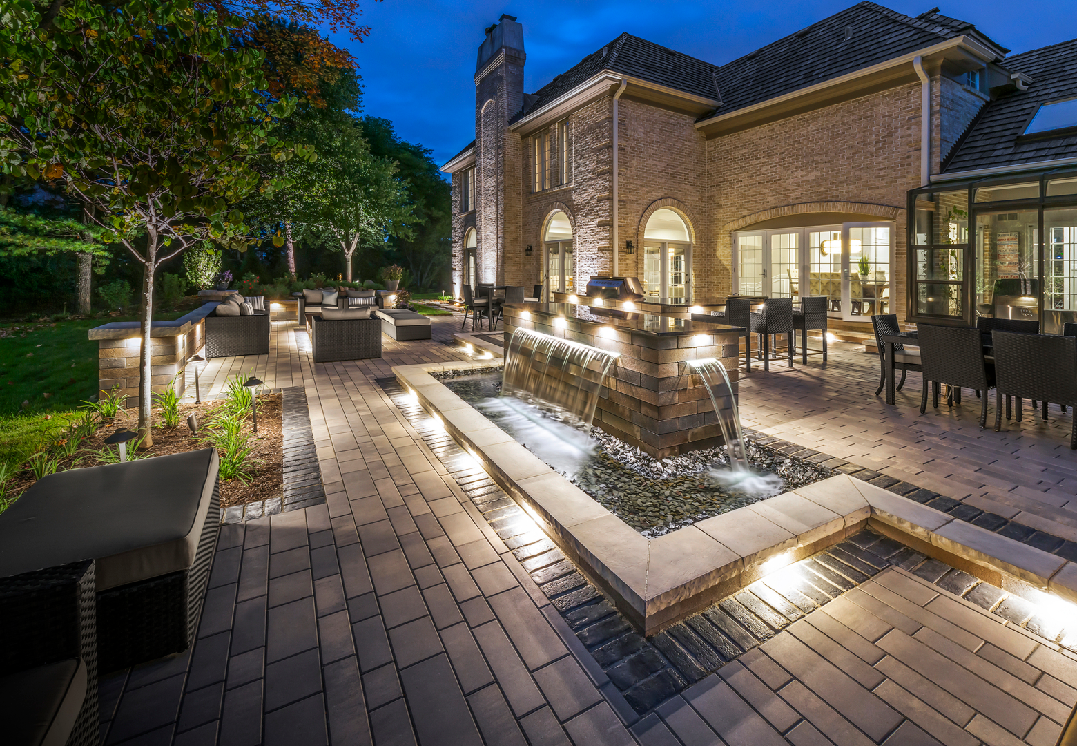 Brick house with illuminated outdoor seating