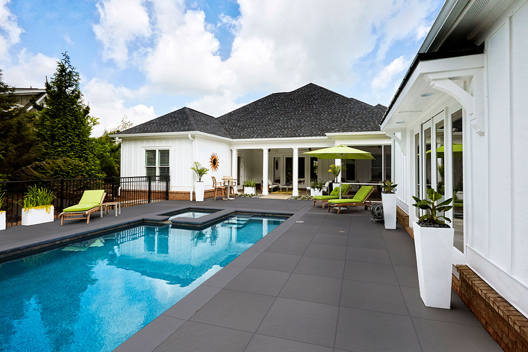 Spacious patio area with pool view.