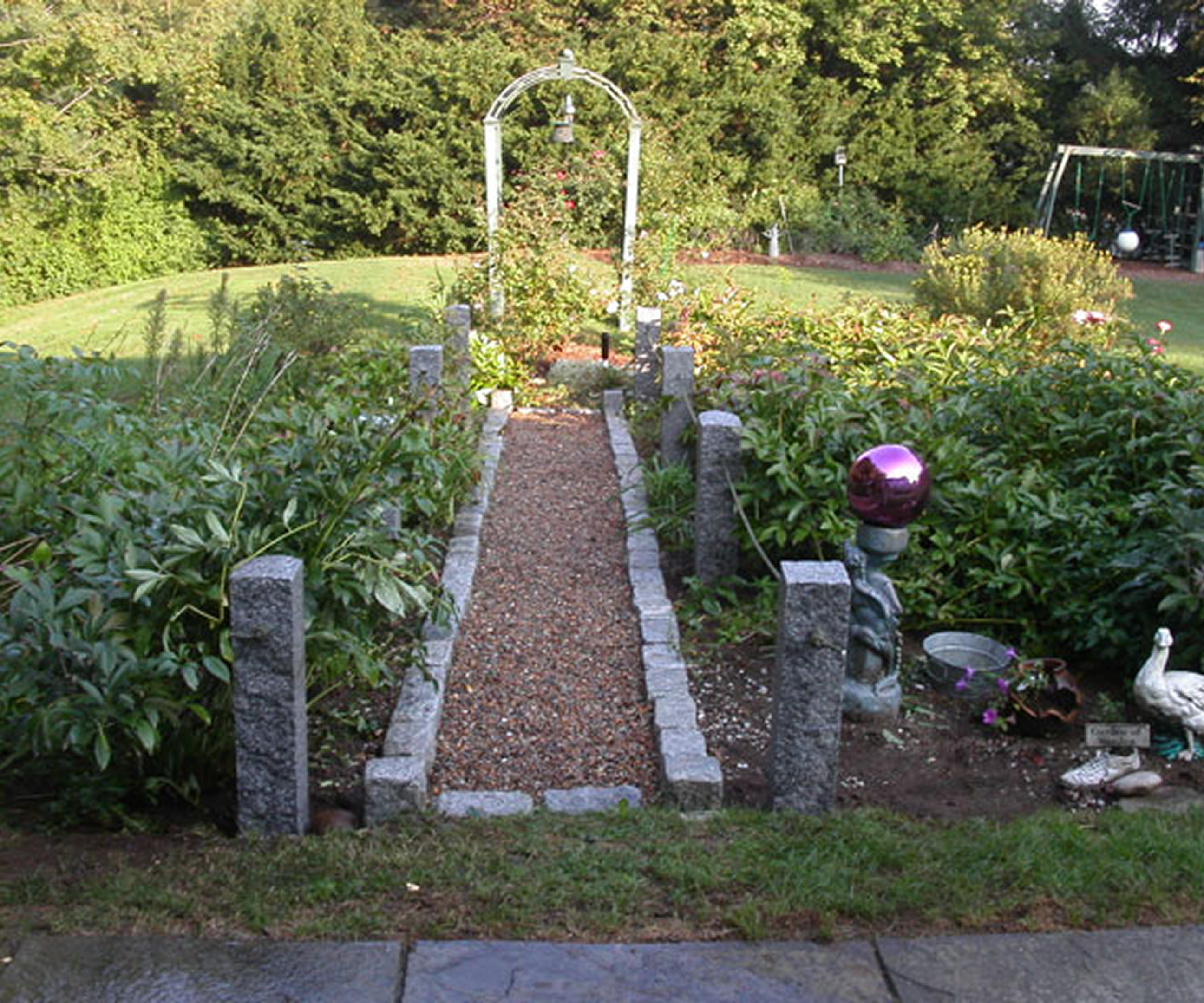 Garden path with archway and greenery