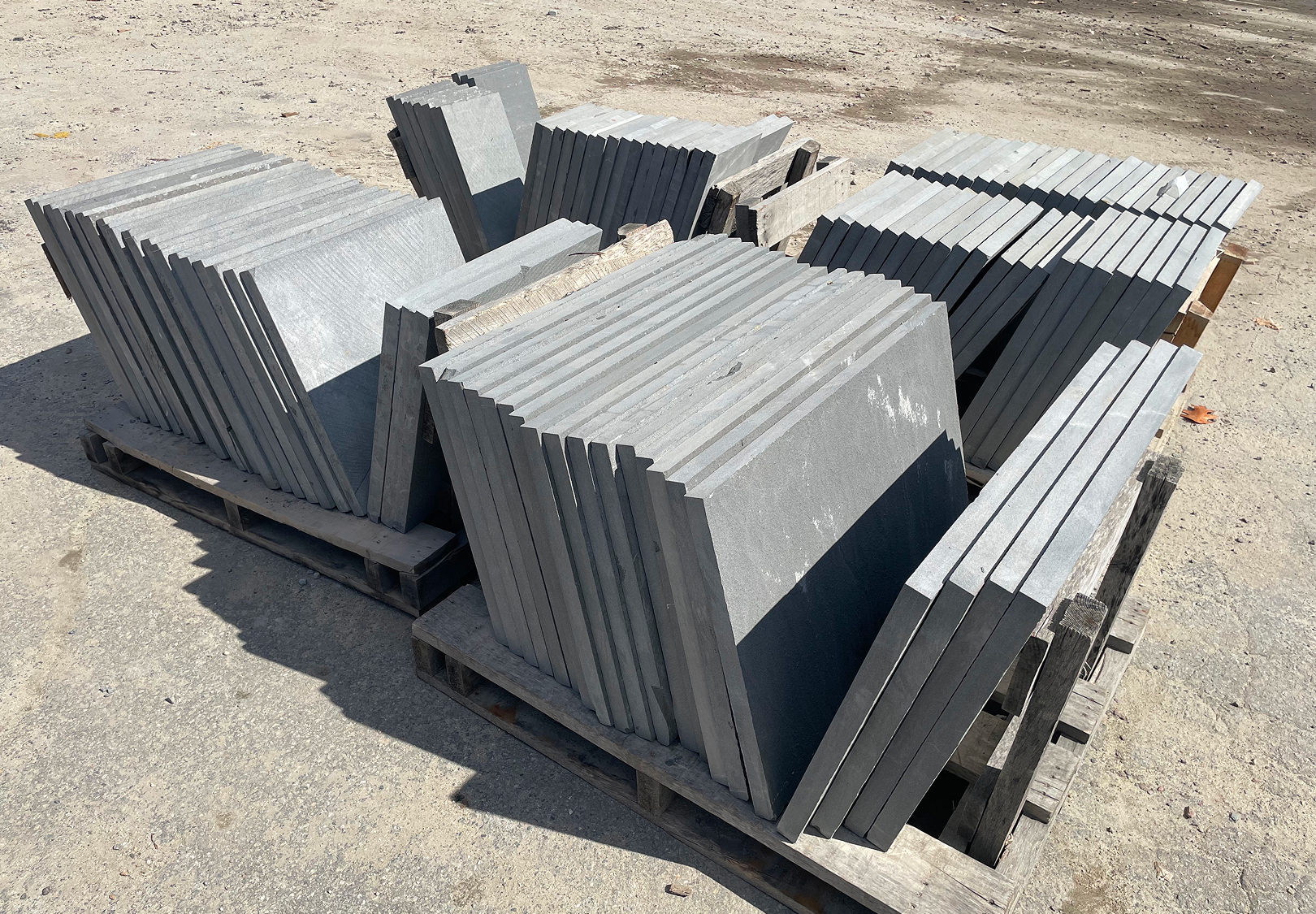 Stone slabs arranged neatly on ground