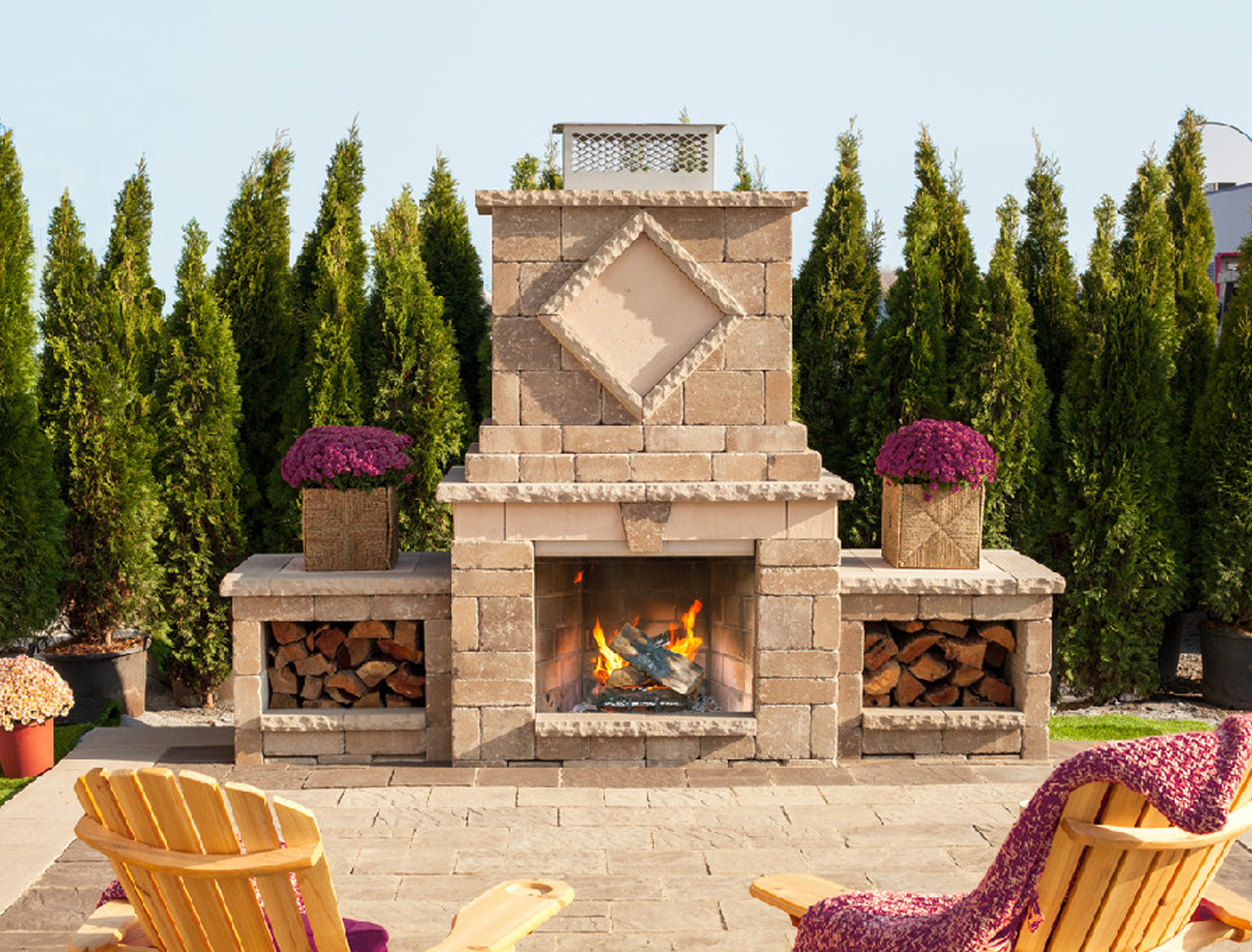 Brick fireplace surrounded by greenery