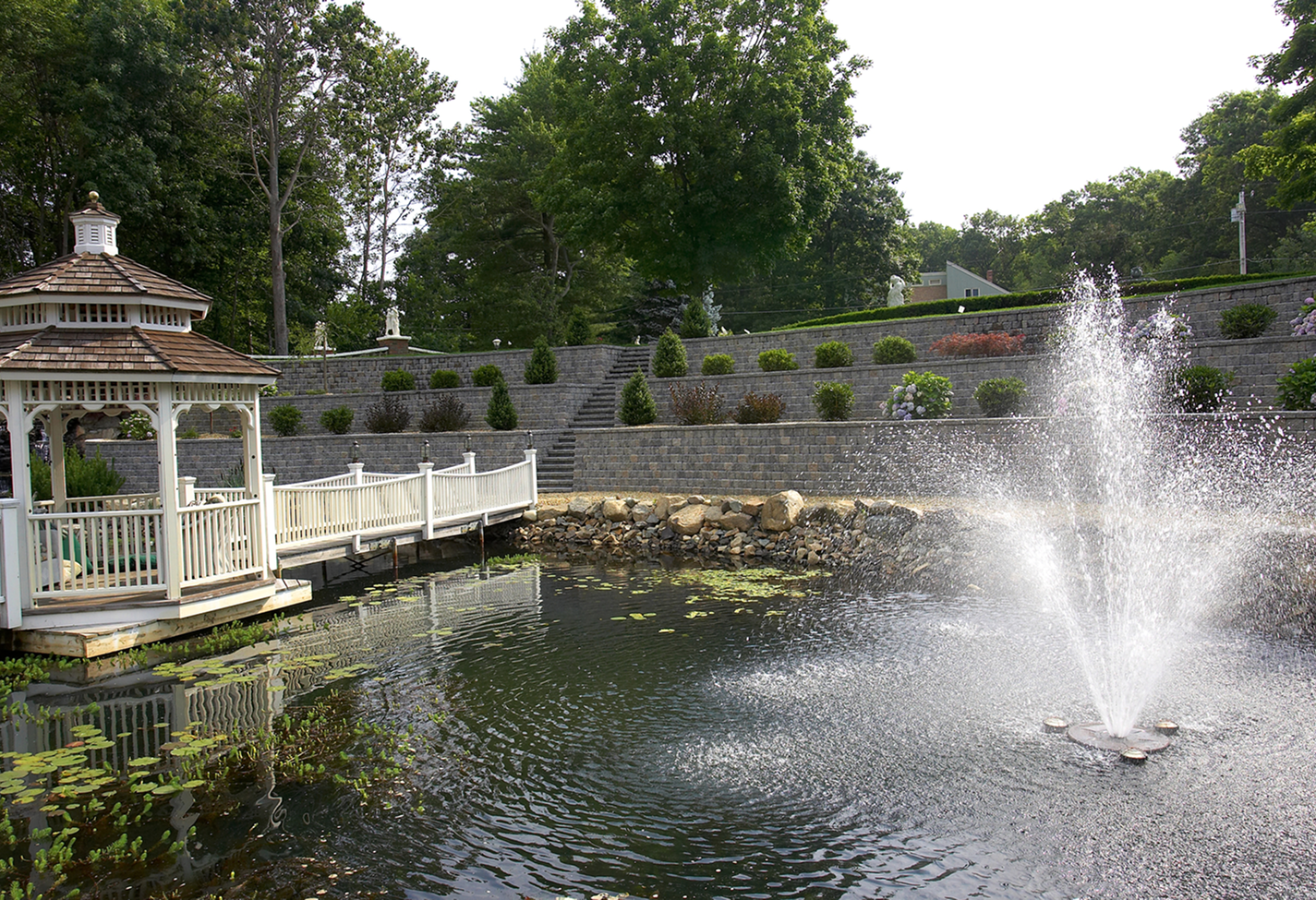 Gazebo by pond with fountain