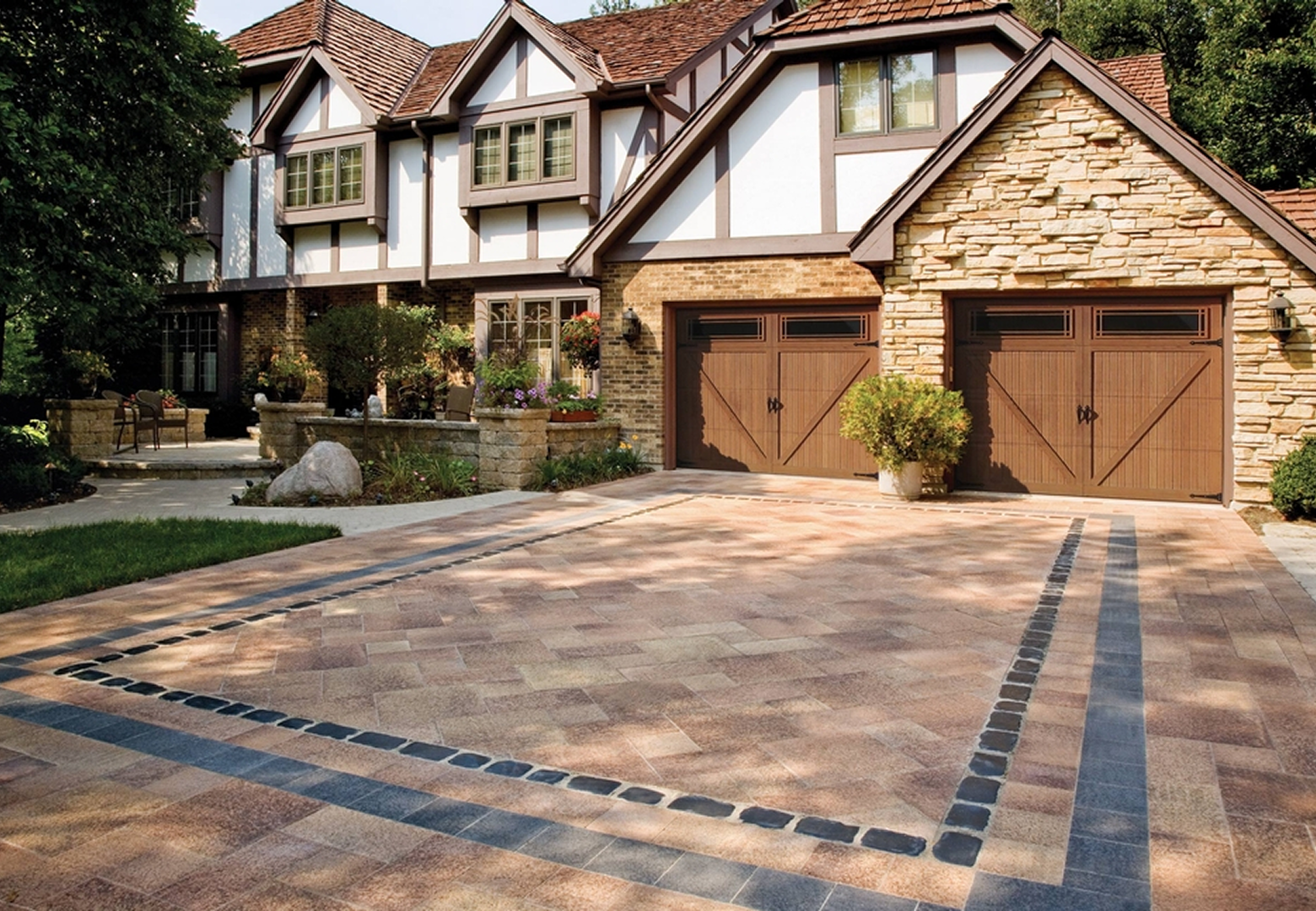 Elegant home with wooden garage doors