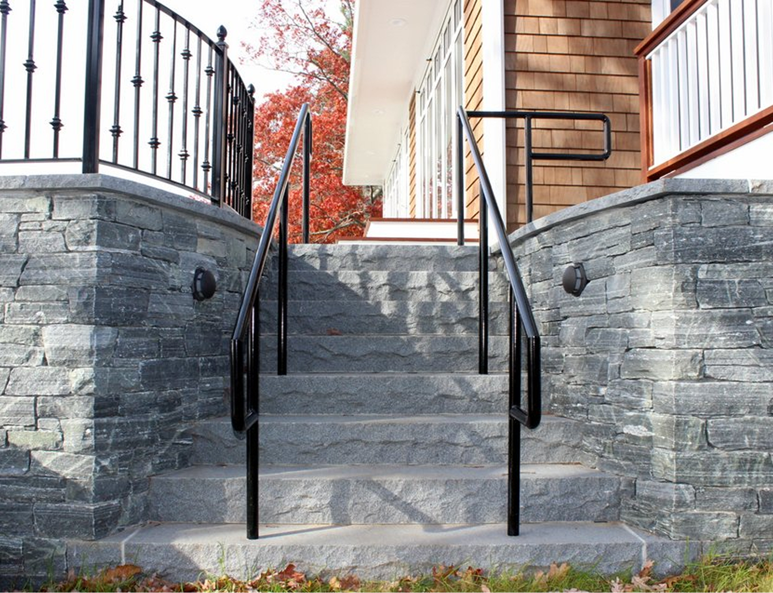 Stone steps with black railings