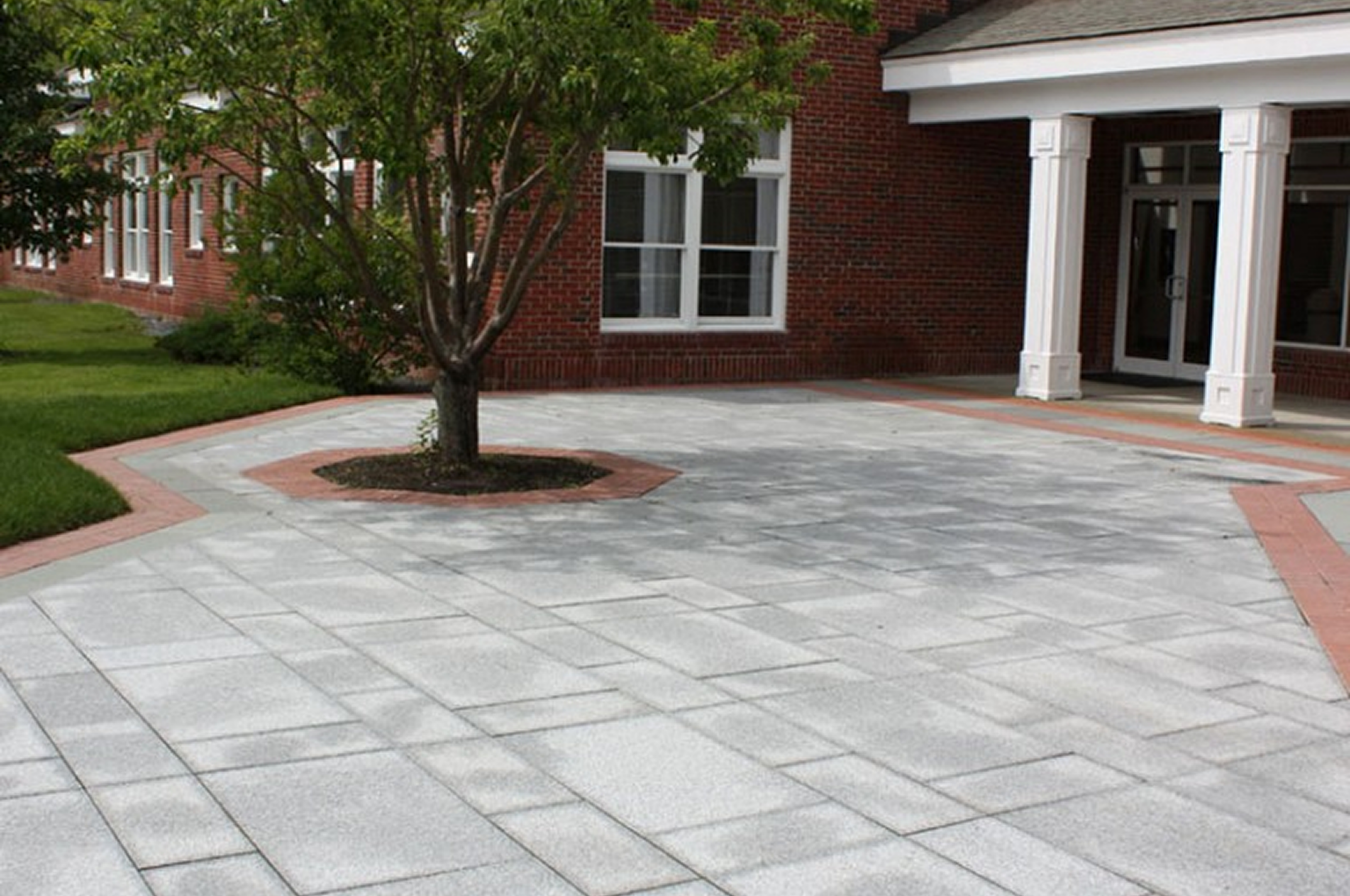 Brick building with paved courtyard