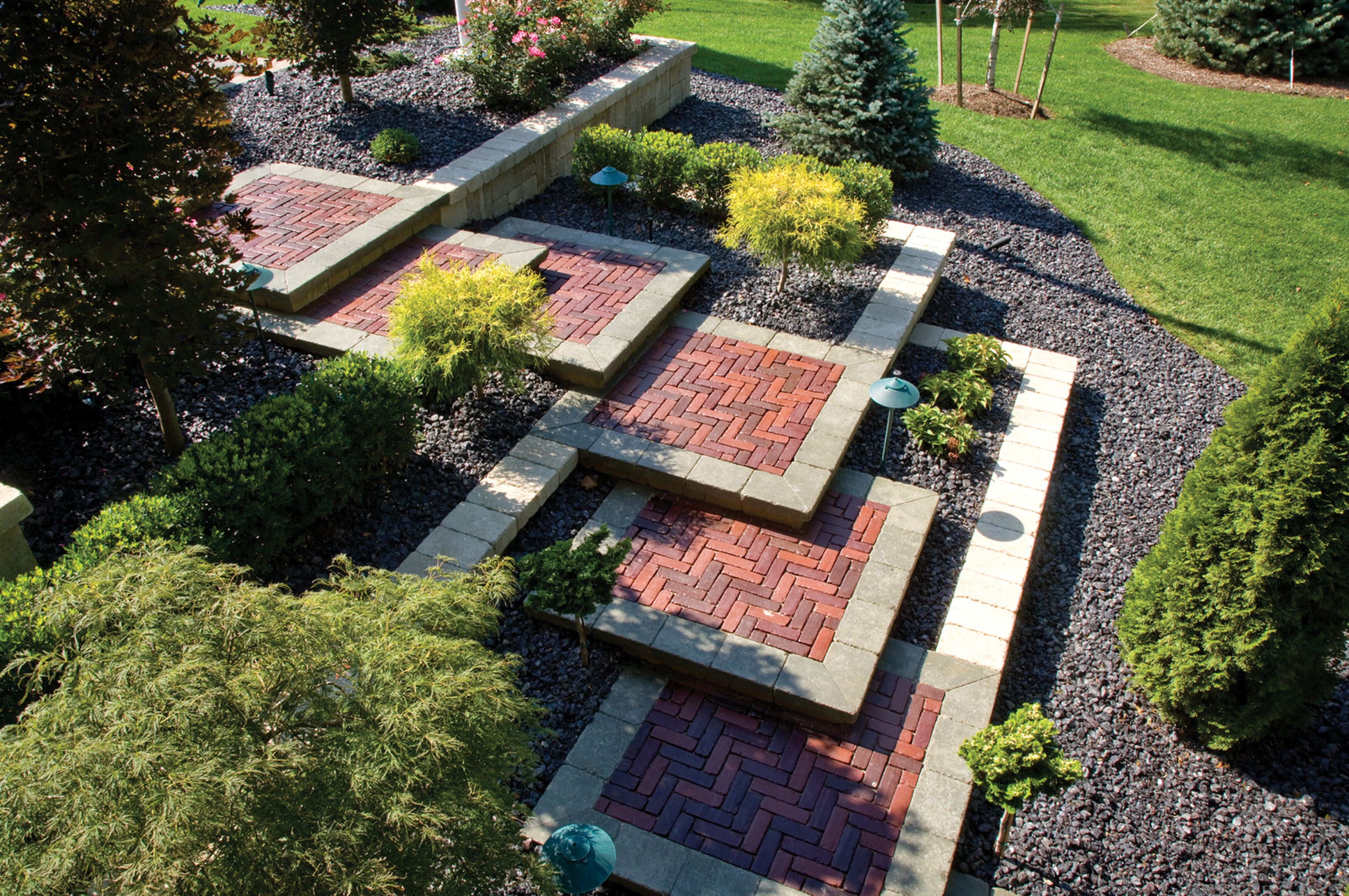 Landscape featuring elevated brick terraces