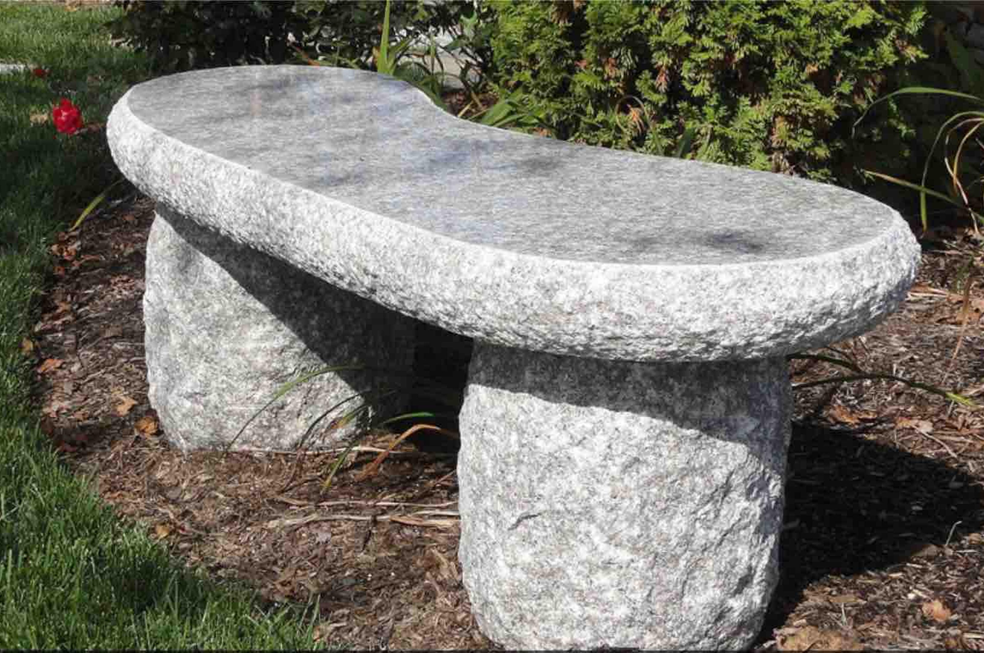 Outdoor stone seating near plants