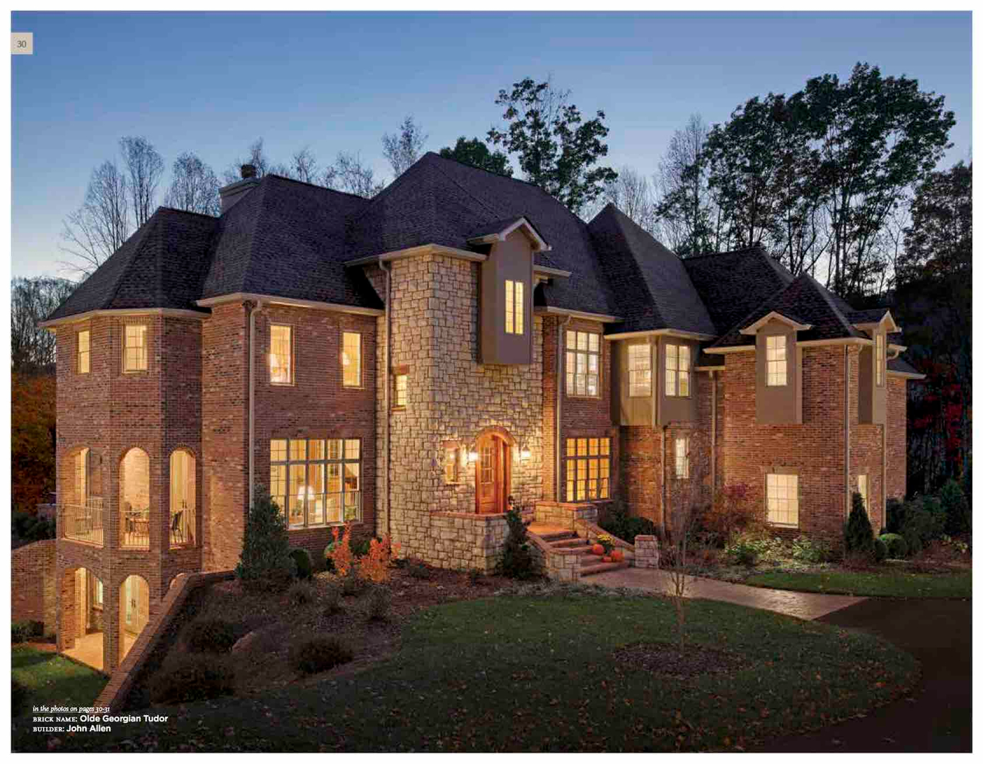 Large brick house at dusk