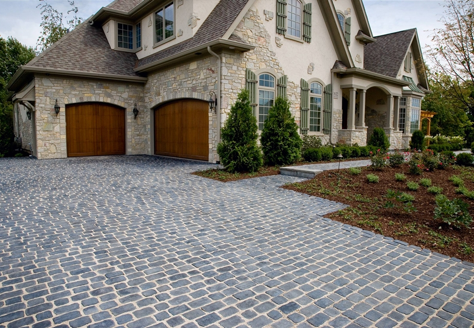 Stone house with cobblestone driveway