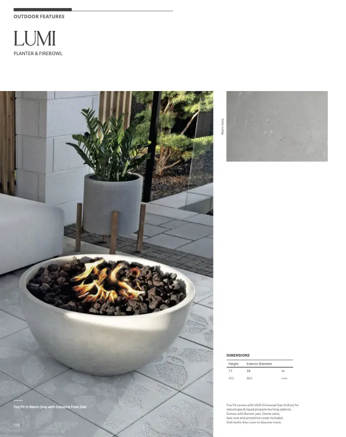 Round concrete fire bowl on tiled patio