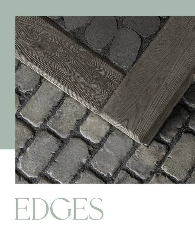 Wooden edging corner on cobblestone pavement