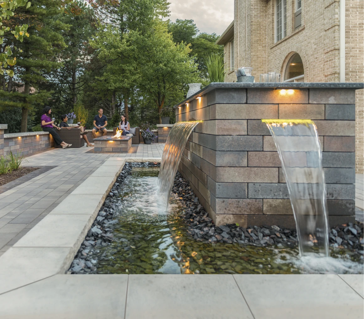 Brick patio with fountains and people relaxing