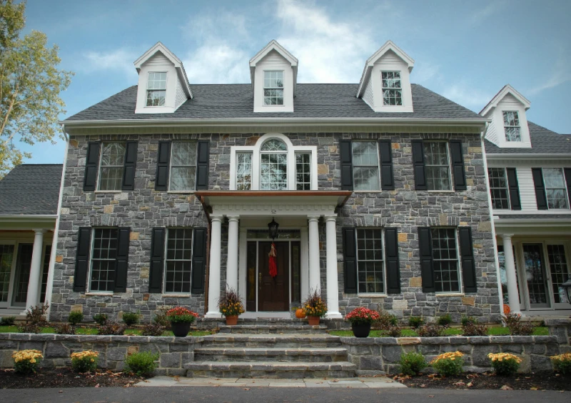 Elegant two-story stone house exterior