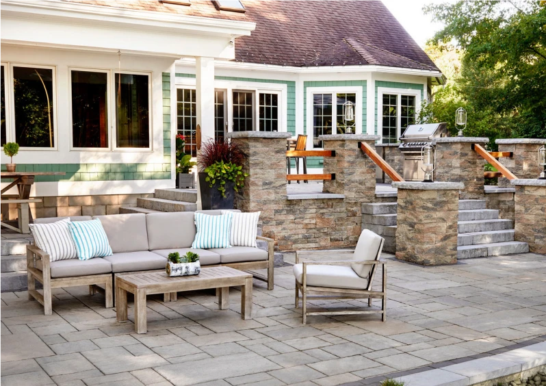 Modern patio with couch and greenery